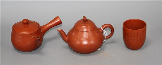 A Chinese Yixing teapot and cover, a redware teapot and cover and a cup
